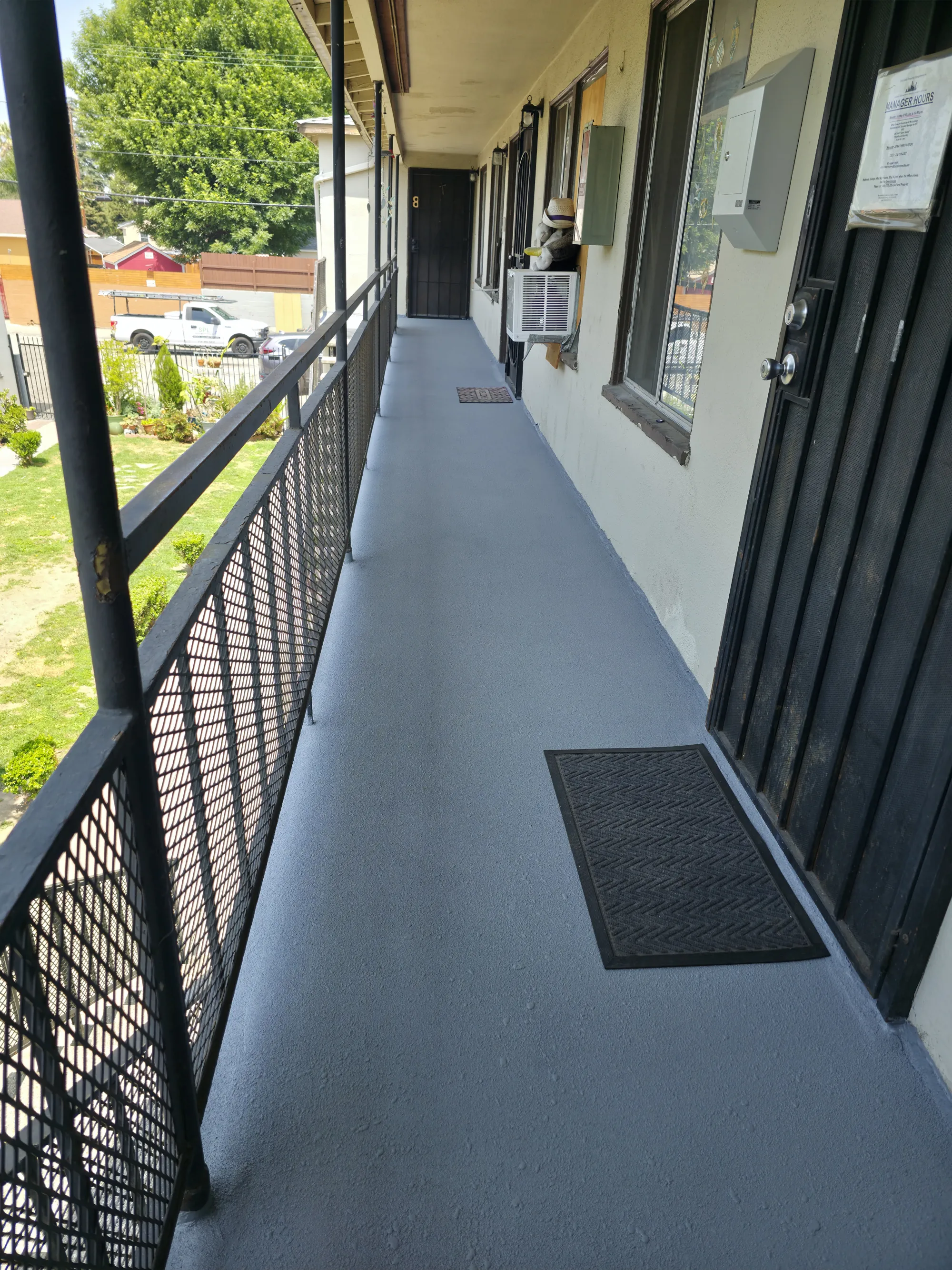 A multi-story apartment complex in Orange County with newly waterproofed walkways and balconies